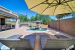 Spacious private backyard w/ swimming pool, outdoor sitting area w/ HDTV, fire pit, BBQ, and putting green